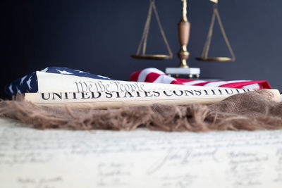 Close-up of text on book at table