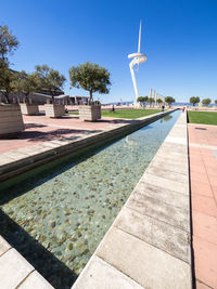 View of swimming pool against clear blue sky