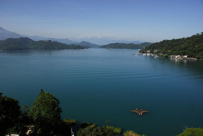 Scenic view of sea against blue sky