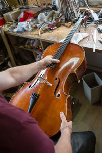 Midsection of woman playing violin