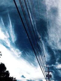 Low angle view of electricity pylon against sky