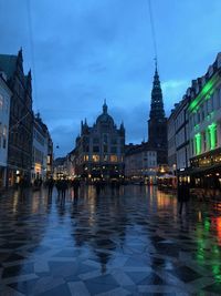 Reflection of buildings in city at night