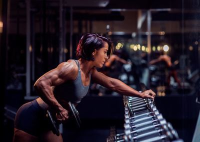 Young woman exercising in gym