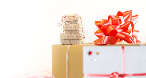 Close-up of christmas decorations over white background