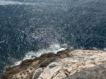 Sea waves splashing on rocks