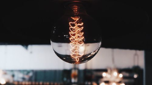 Close-up of illuminated light bulb