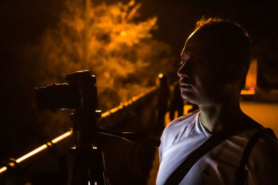 Portrait of young man looking at music concert