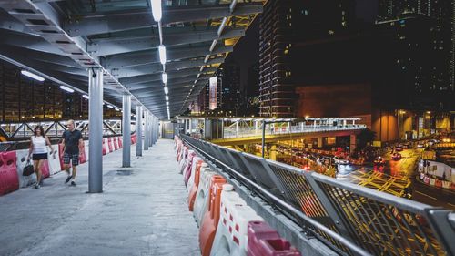 Illuminated bridge at night