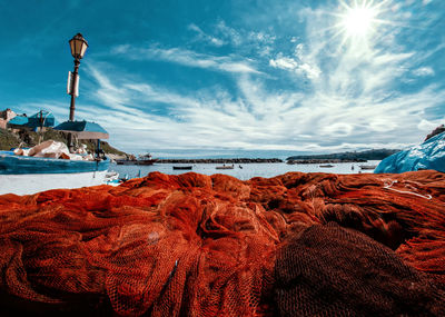 Scenic view of sea against sky with fishing nets