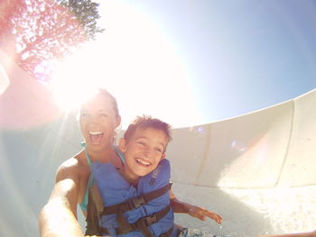 Woman and boy on waterslide