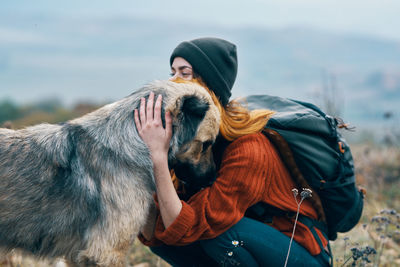 Rear view of man with dog