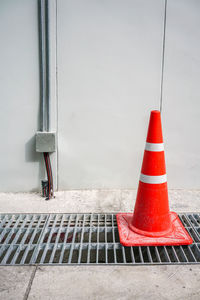 Red umbrella on street against road