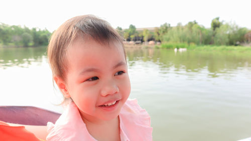 Portrait of cute girl at lake