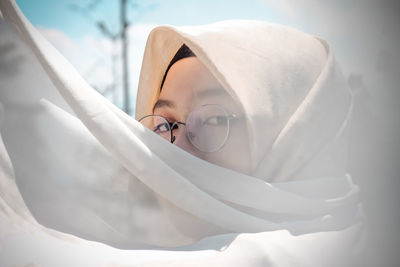 Close-up portrait of beautiful young woman in hijab