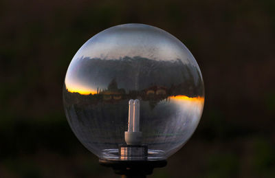 Close-up of crystal ball on glass