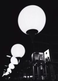 Low angle view of illuminated street light at night