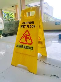 Close-up of yellow road sign