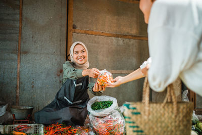 Portrait of woman preparing food