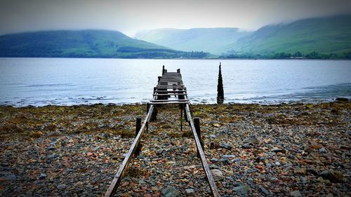 Damaged pier on lakeshore