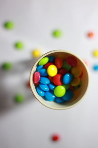 High angle view of multi colored candies on table