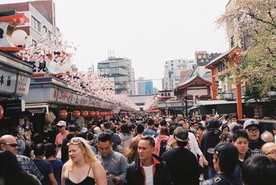 Crowd on street in city