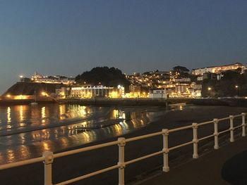 Illuminated city at waterfront