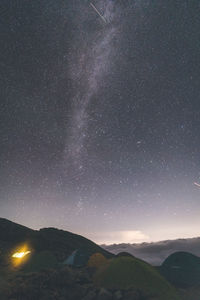 Low angle view of mountain against sky at night