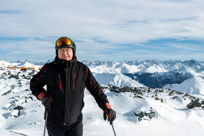 Man skiing on snow covered mountain