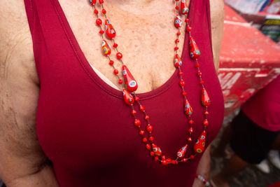 Midsection of woman standing against blurred background