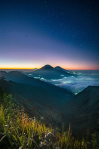 Scenic view of sea against sky at night