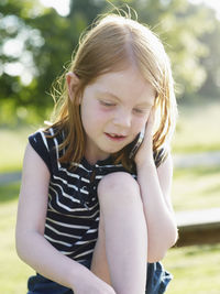 Girl talking on cell phone outdoors