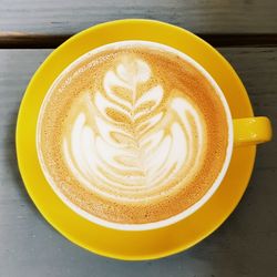 Close-up of cappuccino served on table