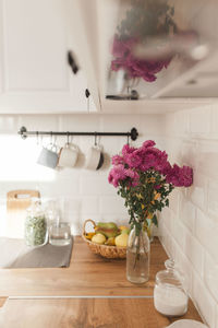 Flower vase on table at home