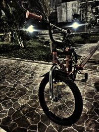 Close-up of bicycle parked at night