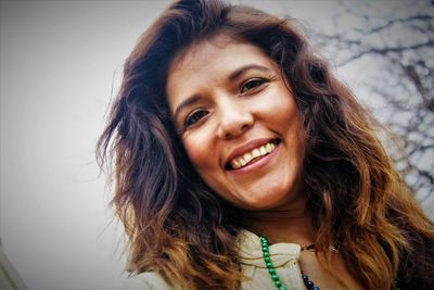 Close-up portrait of a smiling young woman