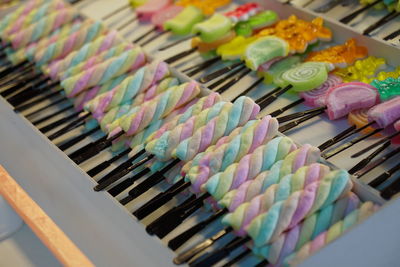 High angle view of multi colored candies at shop for sale