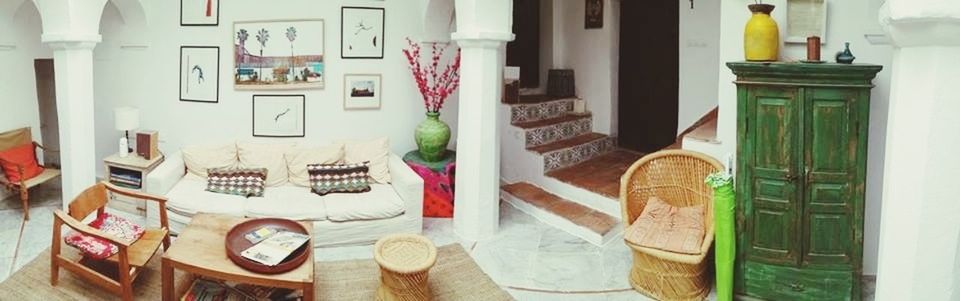 indoors, window, chair, architecture, table, built structure, potted plant, arrangement, shelf, variation, home interior, no people, house, absence, day, empty, in a row, book, balcony, curtain