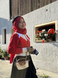 Portrait of muslim girl in hijab and jubah dress in outdoor scenes lifestyle and vacation concept