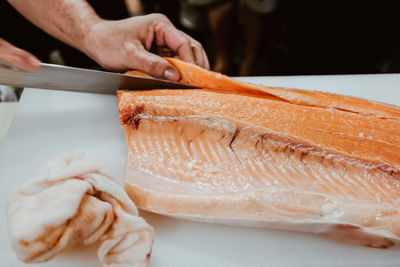 Close-up of hand holding fish