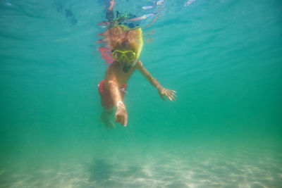 Side view of woman swimming in sea