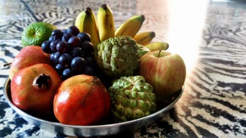 Close-up of fruits in plate on table