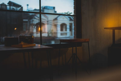 Chairs and table in illuminated building