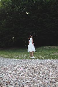 Full length of woman standing on field