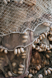 High angle view of fishing net in basket