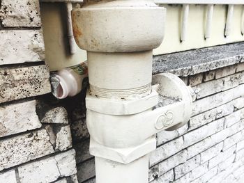 Close-up of white pipes on wall