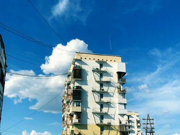 Low angle view of building against blue sky