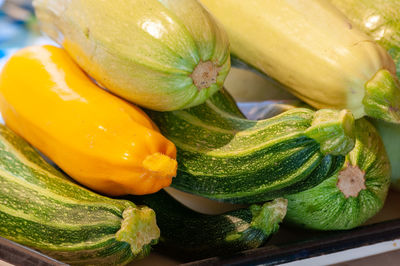 Close-up of pumpkin with yellow bell peppers