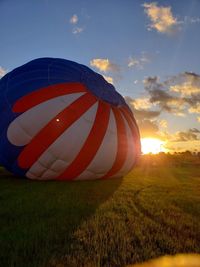 Scenic view of field against sky during sunset