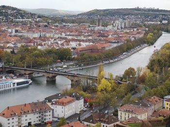 High angle view of river amidst buildings in city