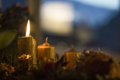 Close-up of illuminated tea light candles